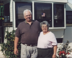 Ron and Janet in front of our trailer
